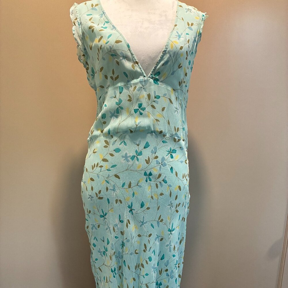 Pale mint green, V-neck, long, sleeveless dress.